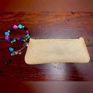 Woven clutch with bright beaded wristlet